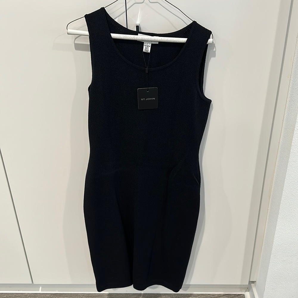 Black knit dress never worn. Brand new with tags. St.John collection. Size 6